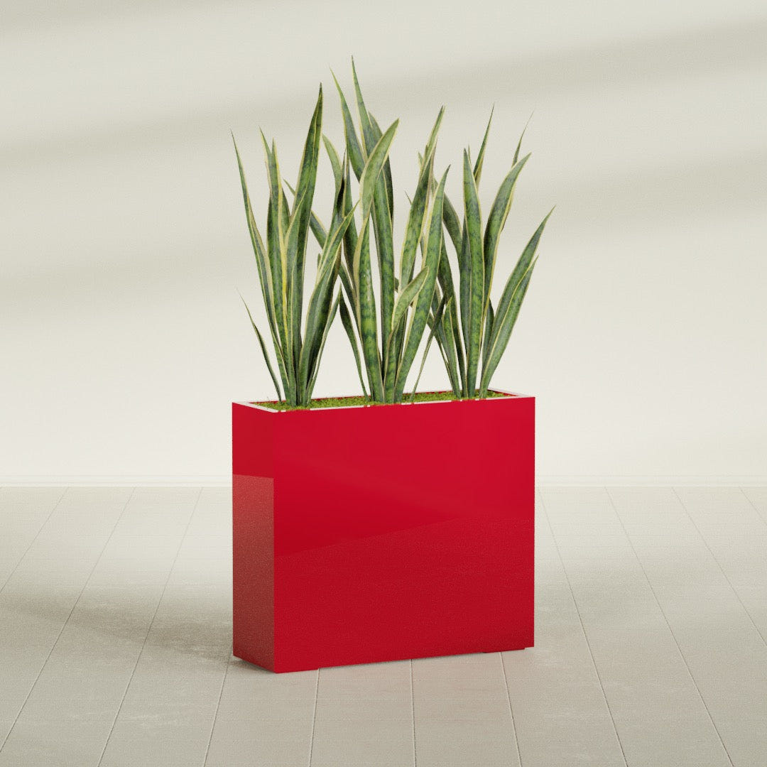 Delray Rectangular fiberglass planter in Gloss Red, shown planted, in a sunlit interior