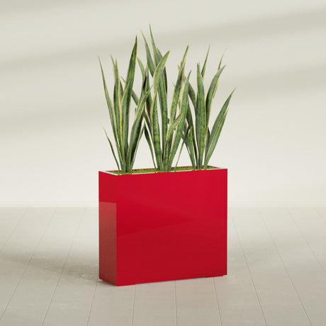 Delray Rectangular fiberglass planter in Gloss Red, shown planted, in a sunlit interior