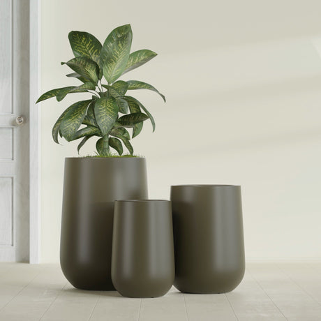Hayden Urn fiberglass planter in Matte Bronze, size range, in a sunlit interior
