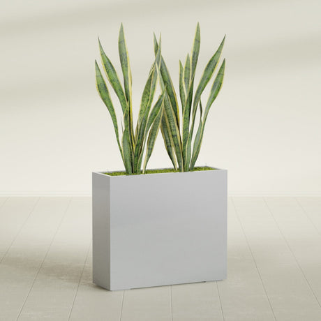 Perth Corner fiberglass planter in Metallic Silver, shown planted, in a sunlit interior