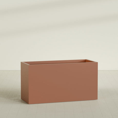 Brisbane Rectangular Planter in Matte Terra Cotta, 60"L × 24"D × 32"H, shown empty