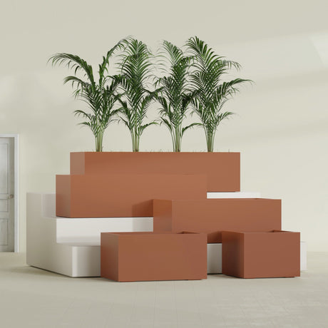 Torino Corner fiberglass planter in Matte Terra Cotta, size range, in a sunlit interior