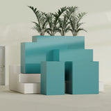 Darwin Corner fiberglass planter in Satin Seafoam Green, size range, in a sunlit interior
