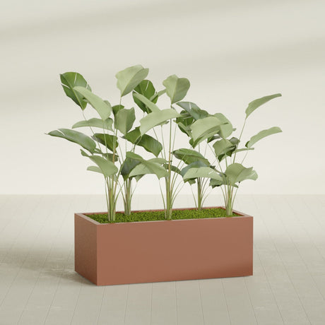 Torino Corner fiberglass planter in Matte Terra Cotta, shown planted, in a sunlit interior