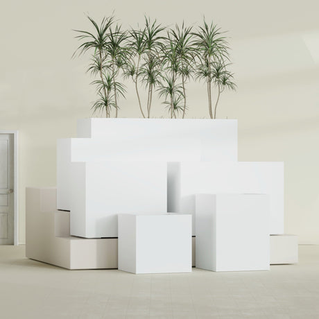 Brisbane Corner fiberglass planter in Matte Bright White, size range, in a sunlit interior