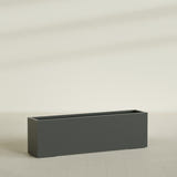 Miami Narrow Rectangular Planter in Matte Charcoal, 60"L × 12"D × 18"H, shown empty