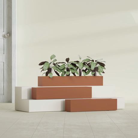 Salon Box fiberglass planter in Matte Terra Cotta, size range, in a sunlit interior