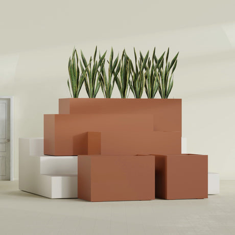 Granada fiberglass planter in Matte Terra Cotta, size range, in a sunlit interior