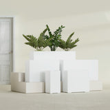 Potsdam Corner fiberglass planter in Matte Bright White, size range, in a sunlit interior