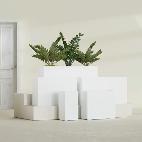 Potsdam Corner fiberglass planter in Matte Bright White, size range, in a sunlit interior