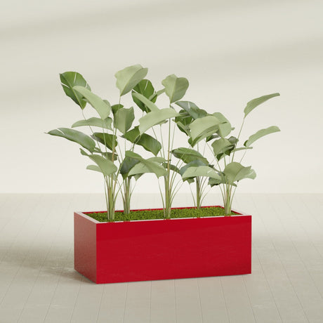 Torino Wide Rectangular fiberglass planter in Gloss Red, shown planted, in a sunlit interior
