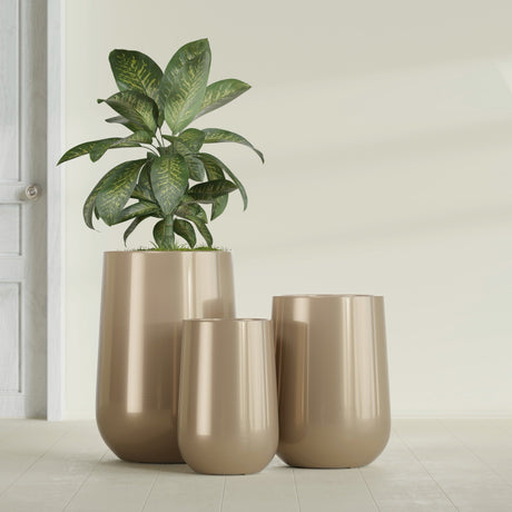 Hayden Urn fiberglass planter in Gloss Metallic Gold, size range, in a sunlit interior