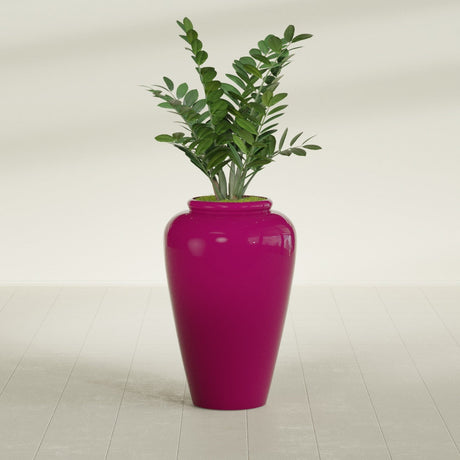 Barà Jar fiberglass planter in Gloss Eggplant, shown planted, in a sunlit interior