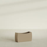 Seoul Curved Planter in Gloss Metallic Gold, 32"L × 12"D × 18"H, shown empty