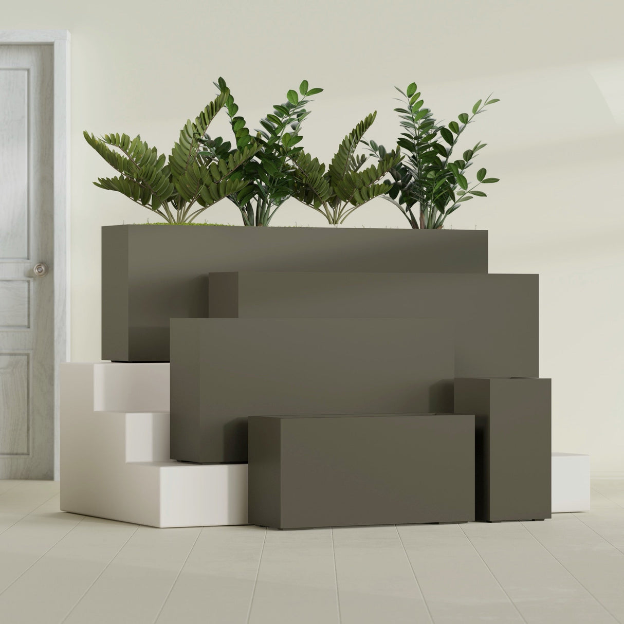 Hollywood Narrow Rectangular fiberglass planter in Matte Bronze, size range, in a sunlit interior