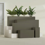 Hollywood Narrow Rectangular fiberglass planter in Matte Bronze, size range, in a sunlit interior