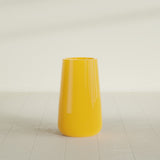 Saigon Tapered Round Planter in Gloss Saffron, 16"D × 36"H, shown empty