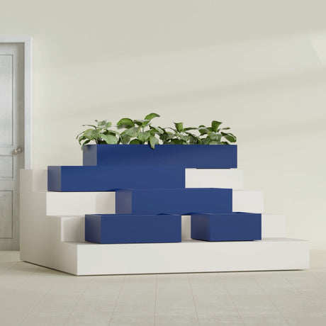 Antwerp Rectangular fiberglass planter in Matte Cobalt Blue, size range, in a sunlit interior