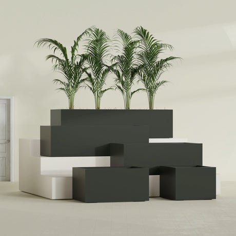 Torino Corner fiberglass planter in Matte Charcoal, size range, in a sunlit interior