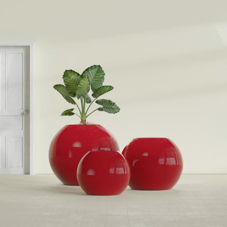 Globe fiberglass planter in Gloss Red, size range, in a sunlit interior