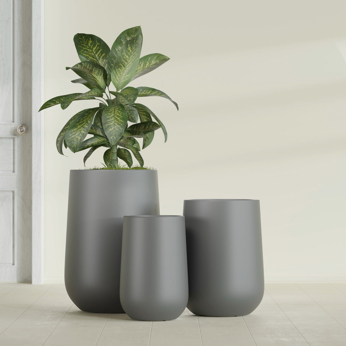 Hayden Urn fiberglass planter in Matte Gunmetal, size range, in a sunlit interior