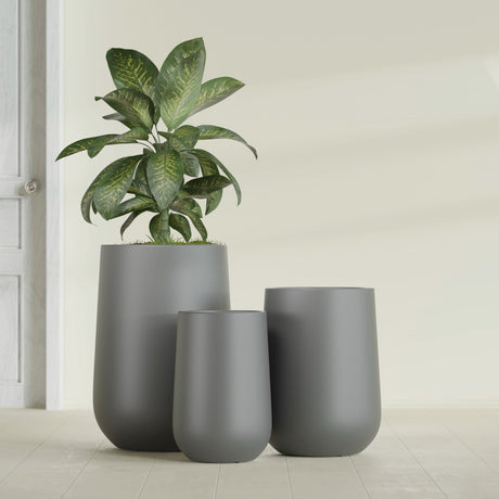 Hayden Urn fiberglass planter in Matte Gunmetal, size range, in a sunlit interior