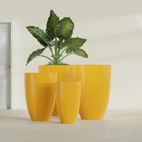 Brannan Tapered Round fiberglass planter in Gloss Saffron, size range, in a sunlit interior
