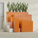 Delray Rectangular fiberglass planter in Gloss Tangerine, size range, in a sunlit interior