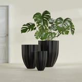Alicante Fluted fiberglass planter in Matte Black, size range, in a sunlit interior