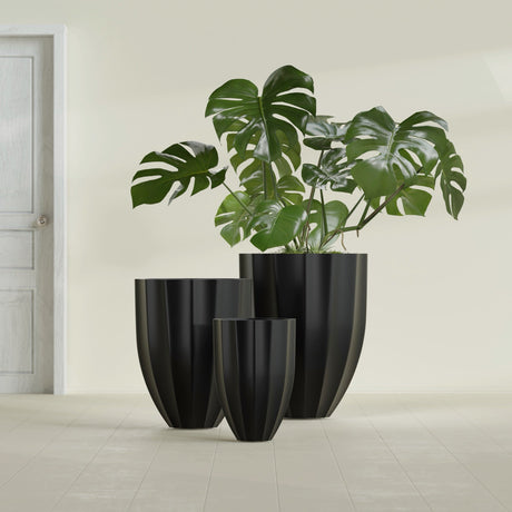 Alicante Fluted fiberglass planter in Matte Black, size range, in a sunlit interior
