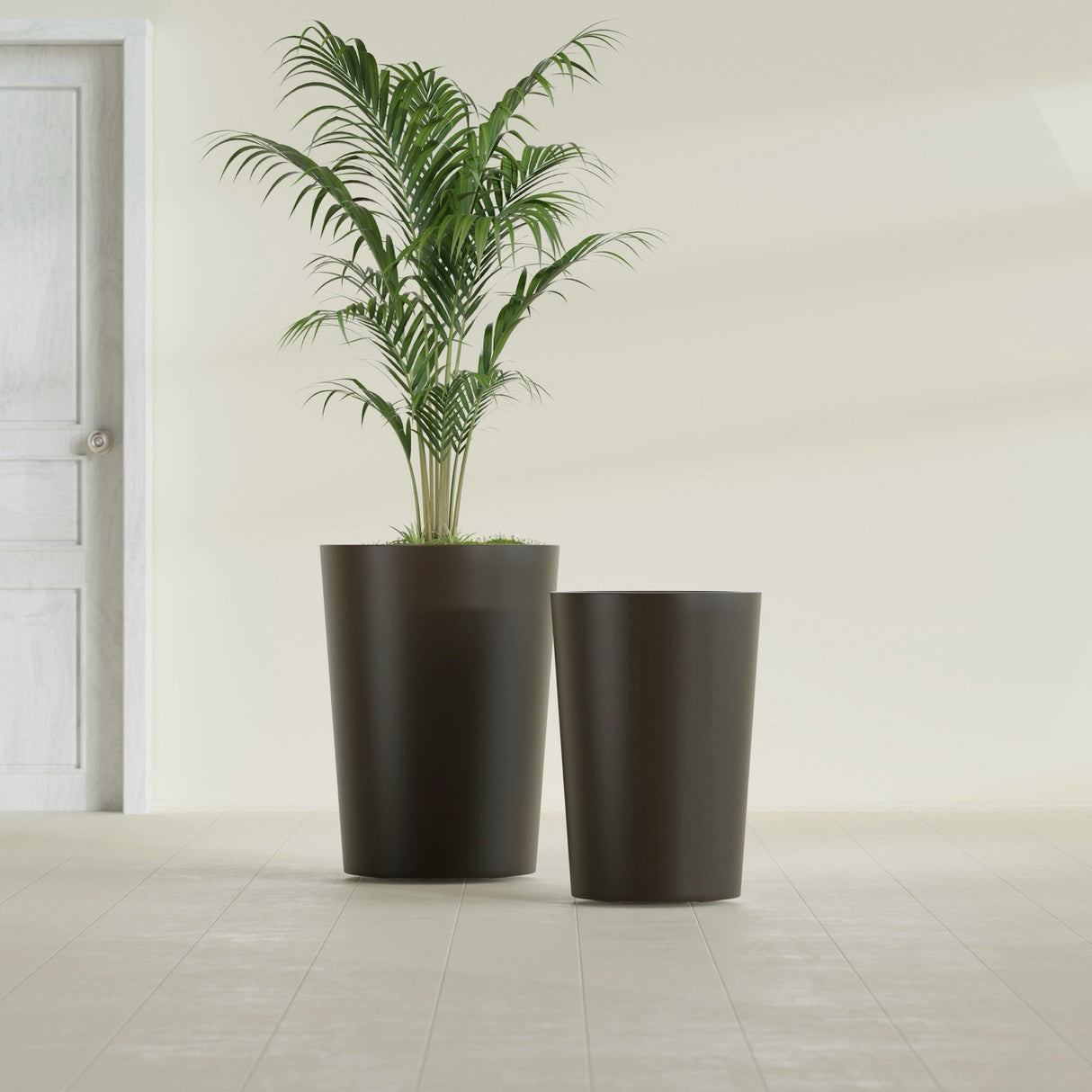 Tegel Round Tapered fiberglass planter in Matte Dark Brown, size range, in a sunlit interior