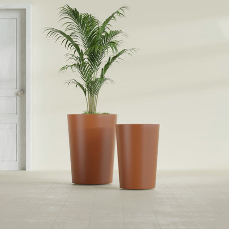 Tegel Round Tapered fiberglass planter in Matte Terra Cotta, size range, in a sunlit interior