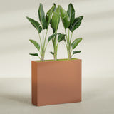 Amesbury Narrow Rectangular fiberglass planter in Matte Terra Cotta, shown planted, in a sunlit interior