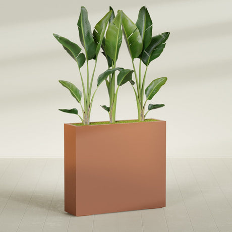 Amesbury Narrow Rectangular fiberglass planter in Matte Terra Cotta, shown planted, in a sunlit interior