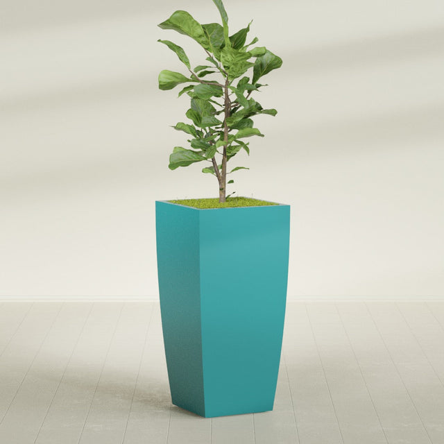Toulan Tall Tapered Square fiberglass planter in Satin Seafoam Green, planted, in a sunlit interior
