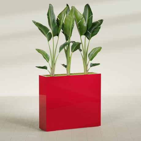 Amesbury Narrow Rectangular fiberglass planter in Gloss Red, shown planted, in a sunlit interior