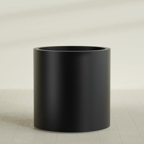 Rio Grande Cylinder Planter in Matte Black, 30"D × 32"H, shown empty