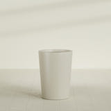 Tegel Round Tapered Planter in Satin Beige, 22"D × 30"H, shown empty