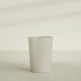 Tegel Round Tapered Planter in Satin Beige, 22"D × 30"H, shown empty