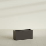 Hollywood Narrow Rectangular Planter in Matte Dark Brown, 36"L × 12"D × 24"H, shown empty