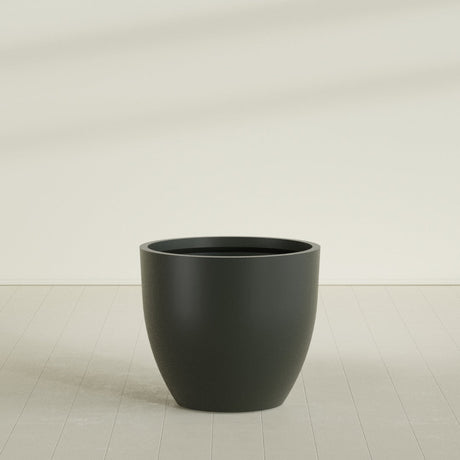Wannsee Round Planter in Matte Charcoal, 44"D × 39"H, shown empty