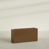 Hollywood Narrow Rectangular Planter in Metallic Bronze, 48"L × 12"D × 24"H, shown empty