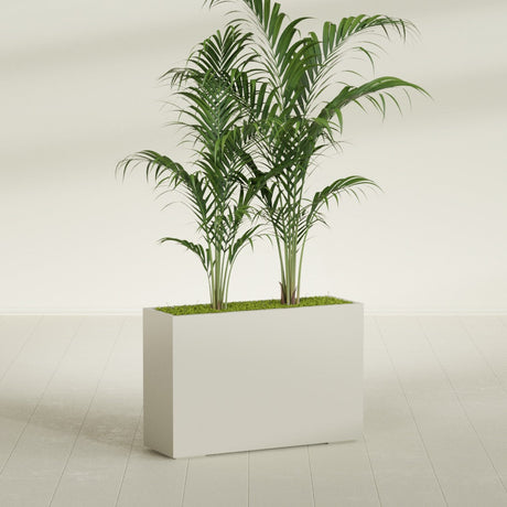 Potsdam Corner fiberglass planter in Satin Beige, shown planted, in a sunlit interior