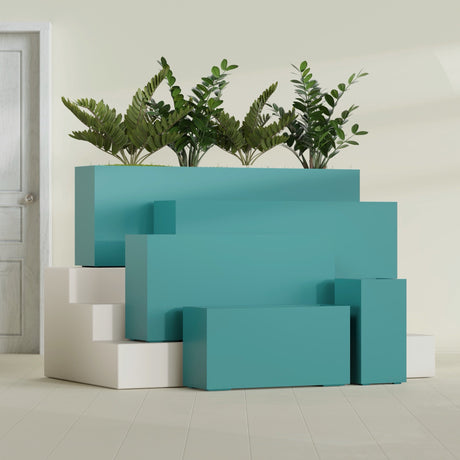Hollywood Corner fiberglass planter in Satin Seafoam Green, size range, in a sunlit interior