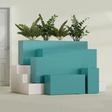Hollywood Narrow Rectangular fiberglass planter in Satin Seafoam Green, size range, in a sunlit interior