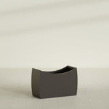 Seoul Curved Planter in Matte Dark Brown, 36"L × 16"D × 24"H, shown empty