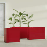 Milano Narrow Rectangular fiberglass planter in Gloss Red, shown planted, in a sunlit interior