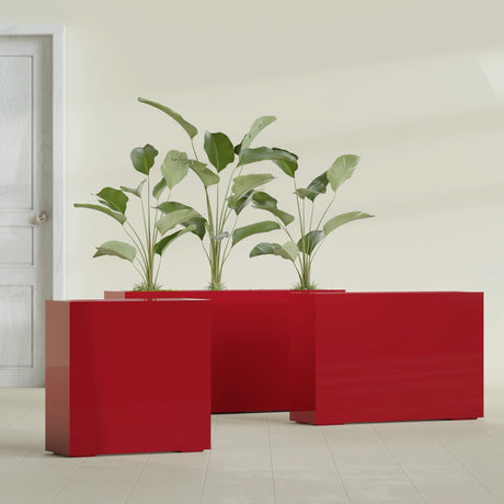 Milano Narrow Rectangular fiberglass planter in Gloss Red, shown planted, in a sunlit interior