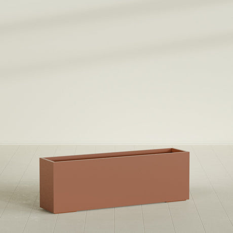 Tolga Rectangular Planter in Matte Terra Cotta, 72"L × 16"D × 24"H, shown empty