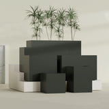 Brisbane Corner fiberglass planter in Matte Charcoal, size range, in a sunlit interior